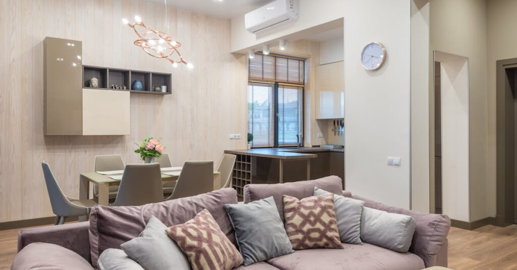 Modern living room and dining area with elegant decor and ample natural light.